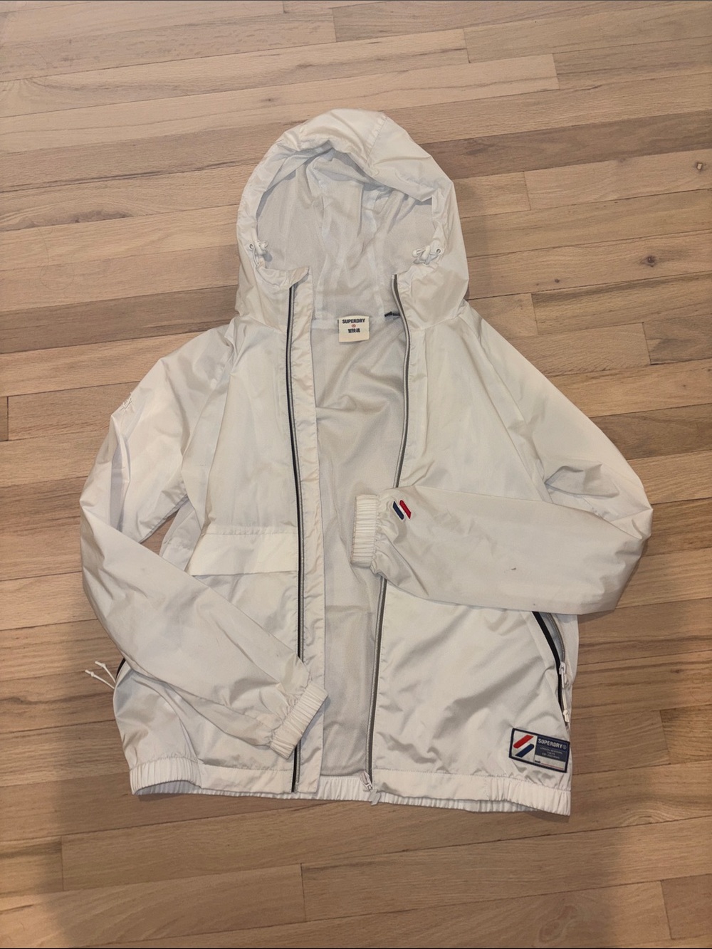 Superdry White Hooded Jacket with Red & Blue Accents